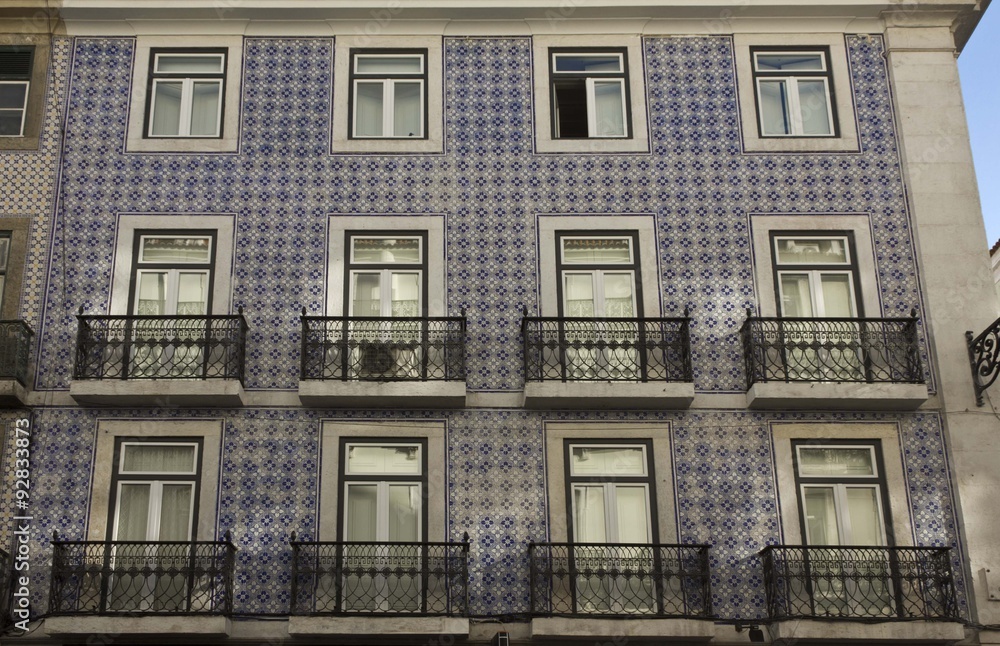 Traditional Portuguese facade, covered with azulejos blue tiles. Lisbon
