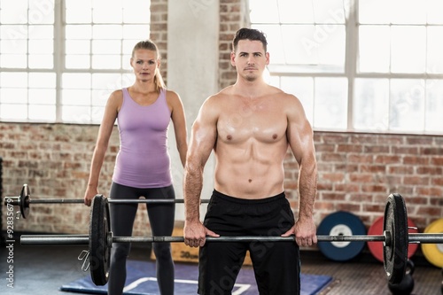 Two fit people working out 