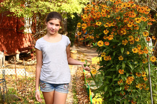  girl stank on  blossoming garden background photo