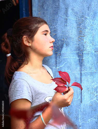  girl portrait with red grapes leaf