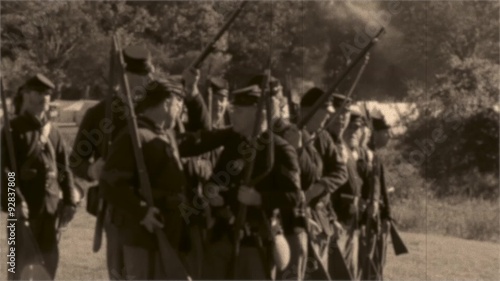 Vintage combatants firing arms