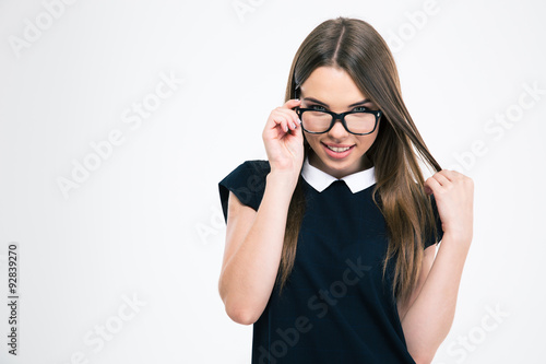 Happy woman in glasses looking at camera