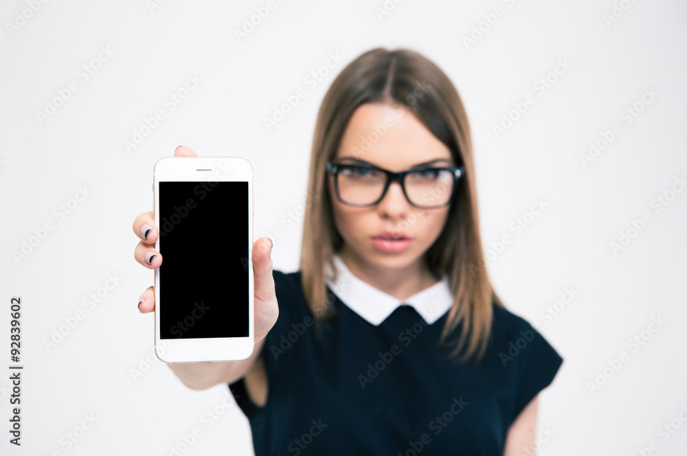 Woman showing blank smartphone screen