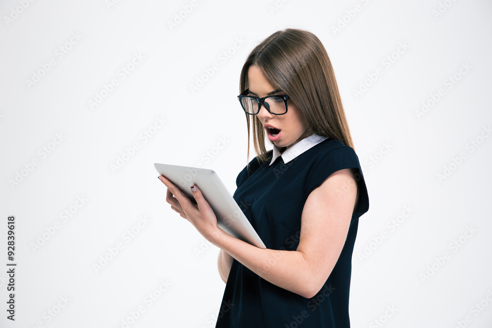 Portrait of a surprised girl using tablet computer Portrait of a surprised girl using tablet computer