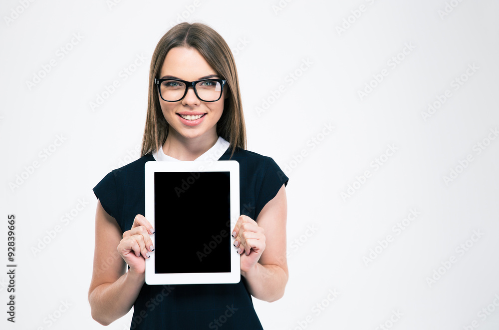 Fototapeta premium Smiling woman showing blank tablet computer screen