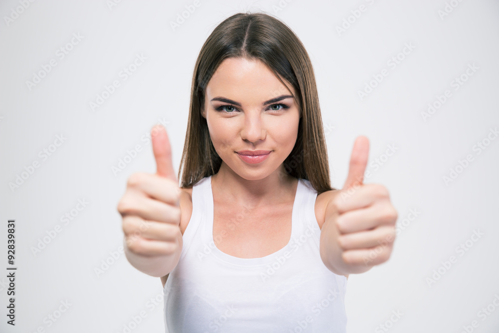 Portrait of a pretty woman showing thumbs up Portrait of a pretty woman showing thumbs up