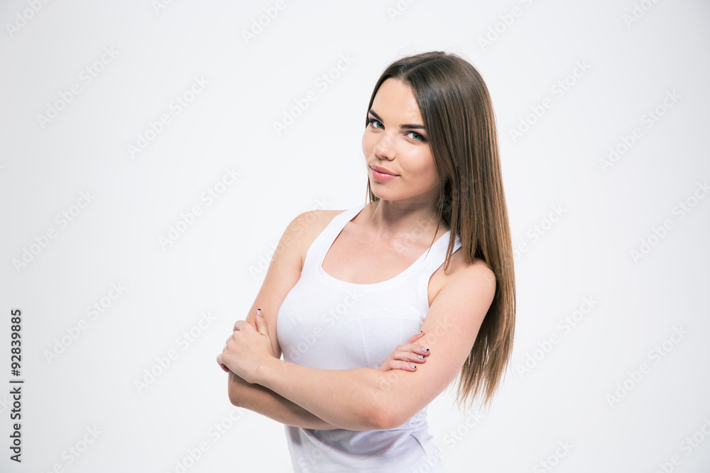 Girl standing with arms folded and looking at camera Girl standing with arms folded and looking at camera