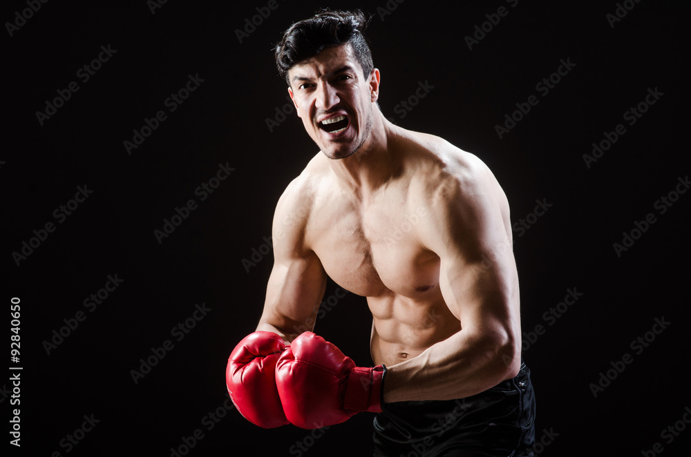 Muscular man in boxing concept