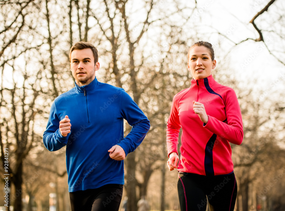 Fototapeta premium Couple jogging together