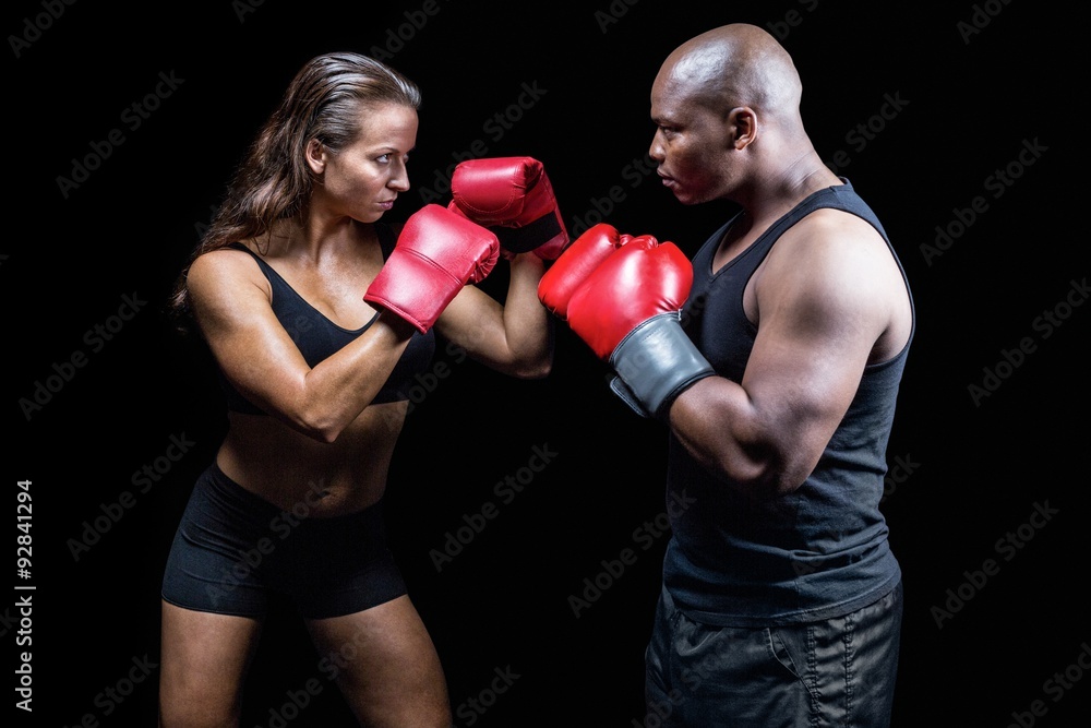 Male and female boxer with fighting stance