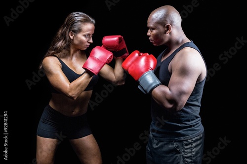 Male and female boxer with fighting stance © WavebreakmediaMicro