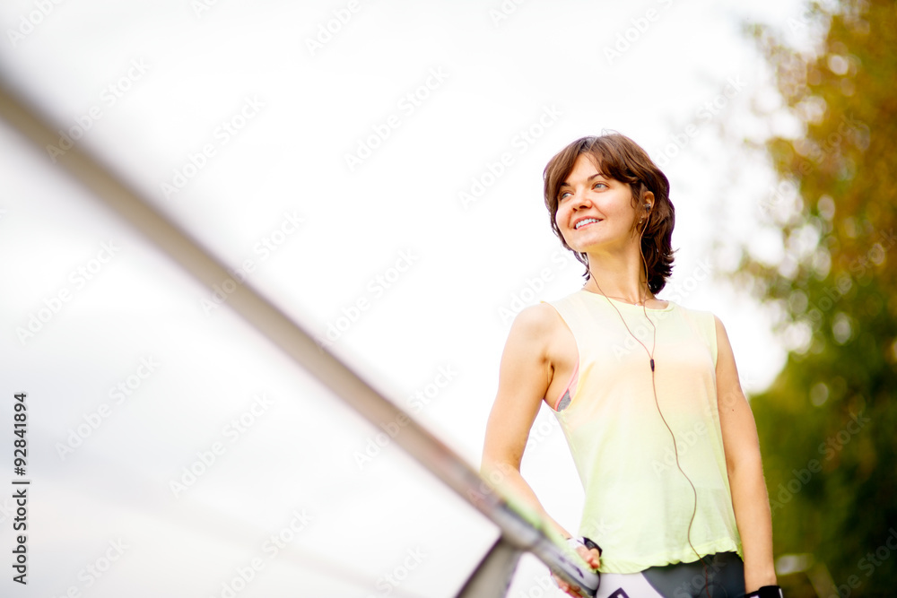 woman with mp3 player doing fitness woman with mp3 player doing fitness