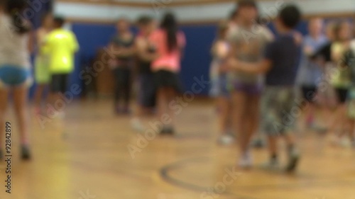 Children dancing in gym class photo