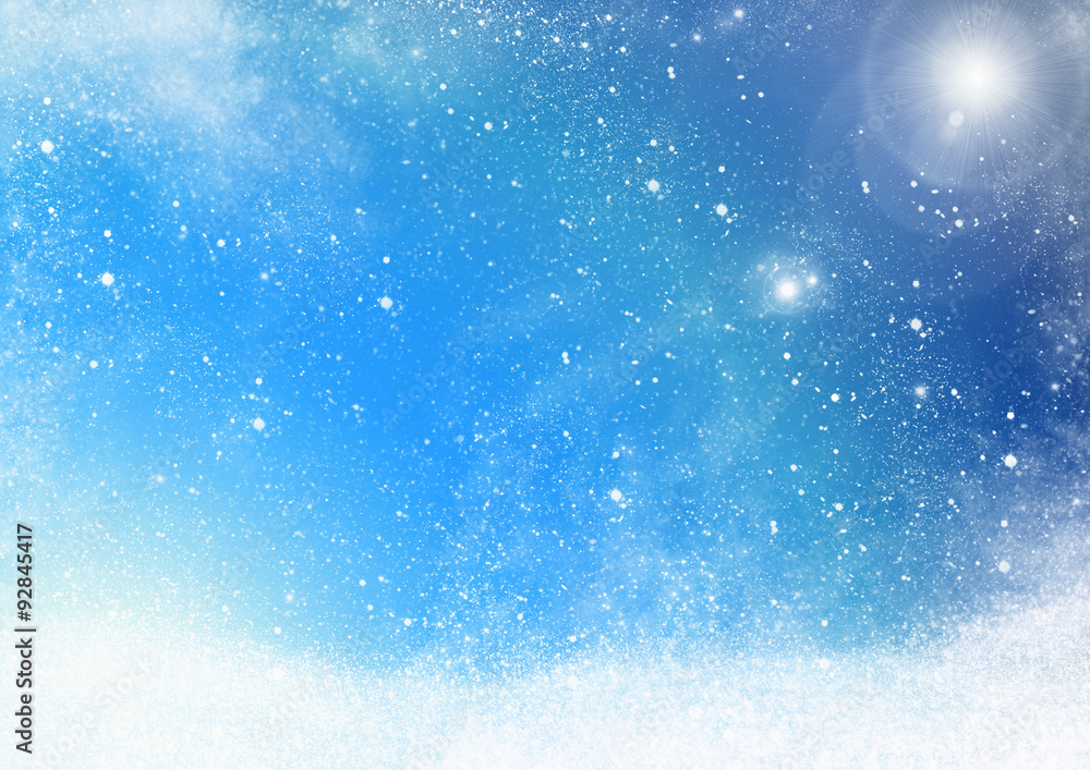 Obraz premium falling snowflakes with sparkling winter sun - backround