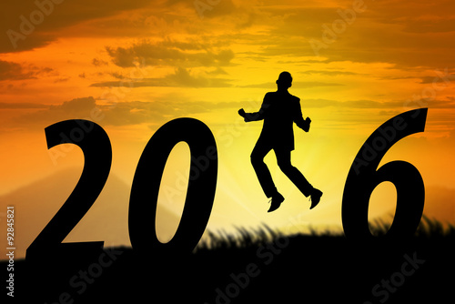 Silhouette of man jumping over 2016