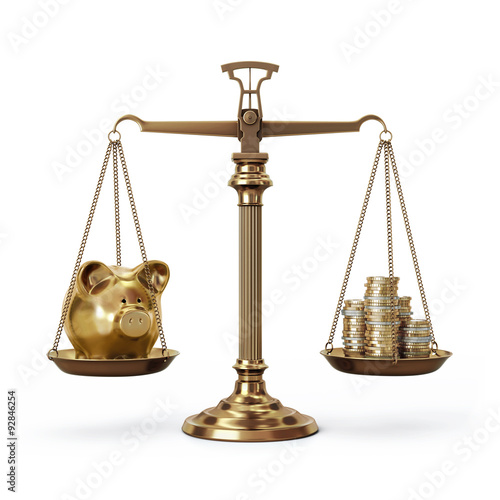 Photos Brass scales with piggy bank and coins - balanced - front view