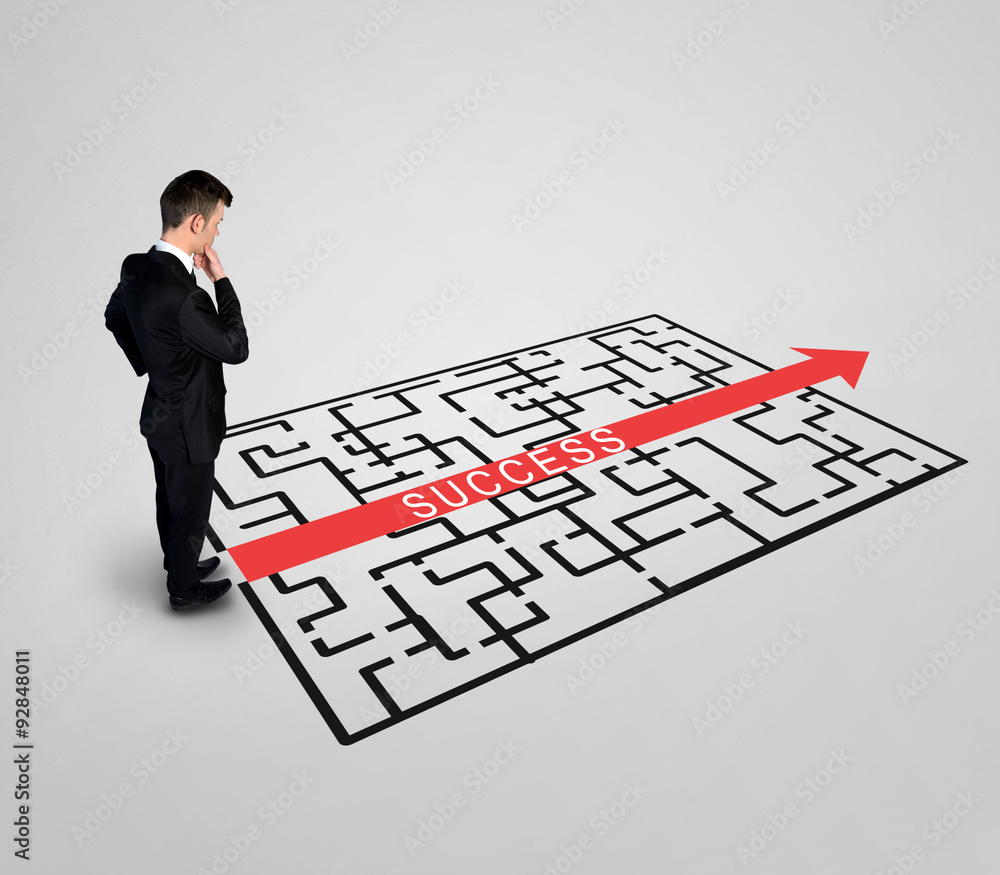 Business man thinking Success word maze Business man thinking Success word maze