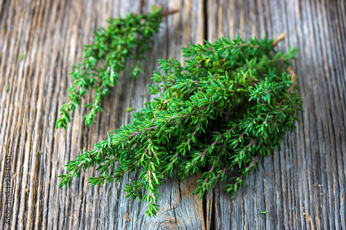 Fresh organic thyme on a wooden background
