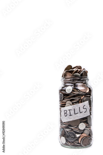 A full glass jar with Bills label