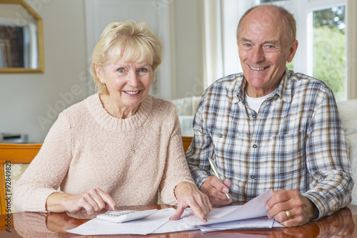 Happy Senior Couple reviewing Domestic Finances Together
