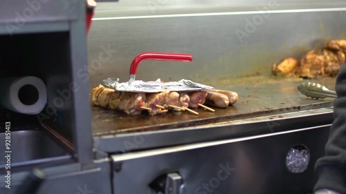 Frying meat in a NYC food stand
