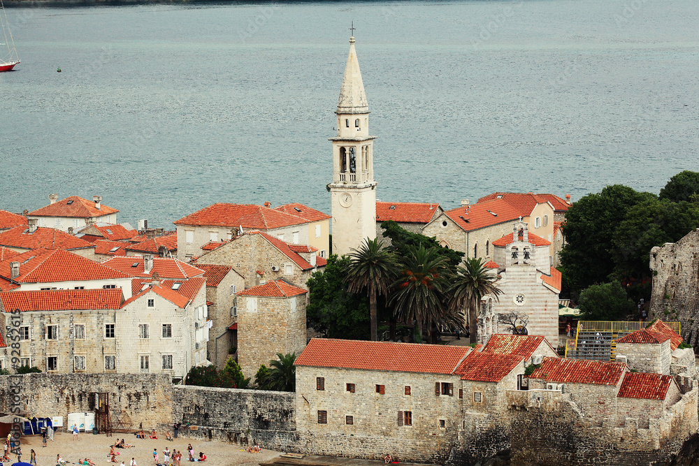 Fototapeta premium building red rooftops European town on the coast