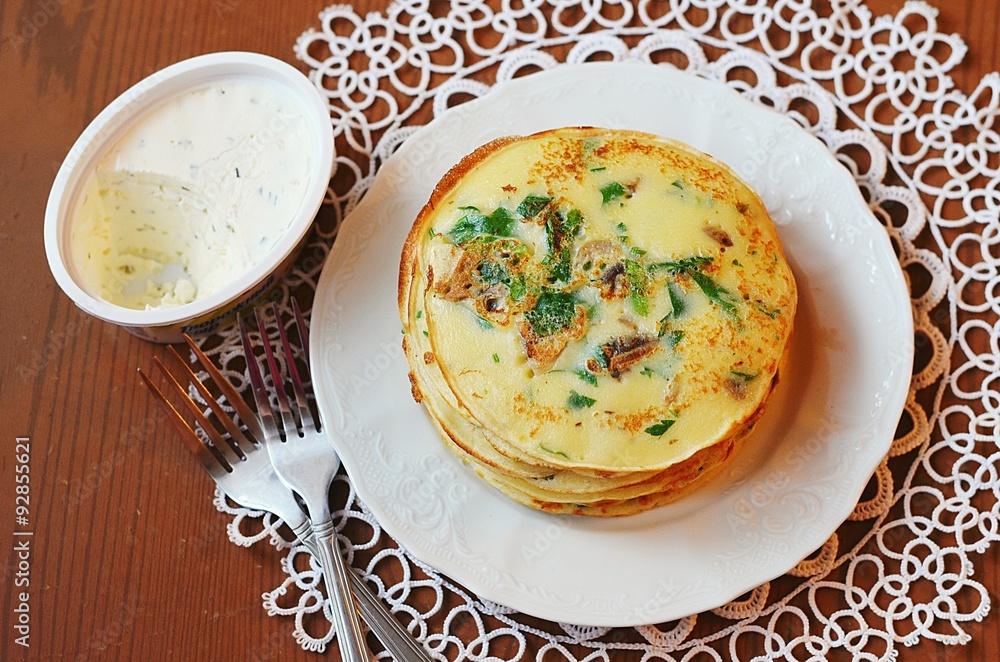 Pancakes with herbs and mushrooms and scrambled eggs for breakfast Pancakes with herbs and mushrooms and scrambled eggs for breakfast