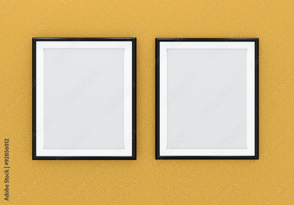 Two black picture frames over orange wall Two black picture frames over orange wall