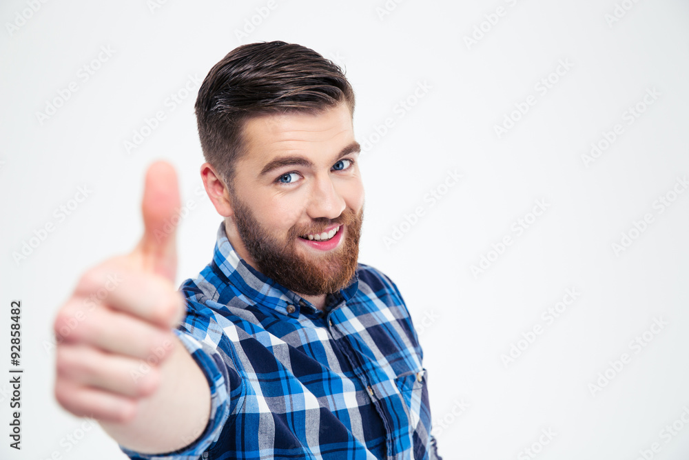 Portrait of a smiling casual man showing thumb up Portrait of a smiling casual man showing thumb up