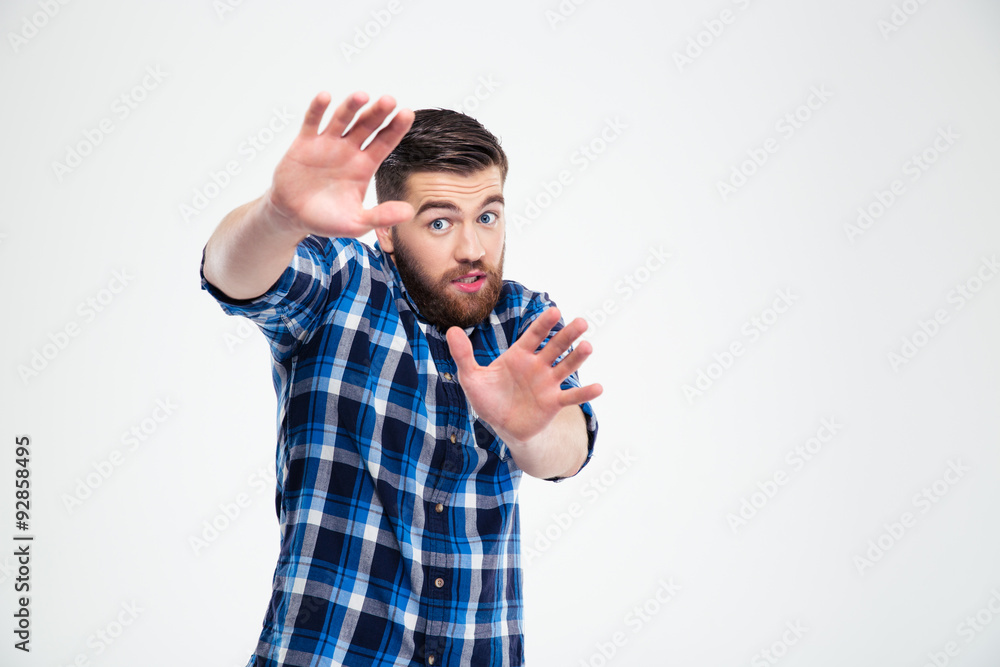 Handsome man showing stop gesture with palms Handsome man showing stop gesture with palms