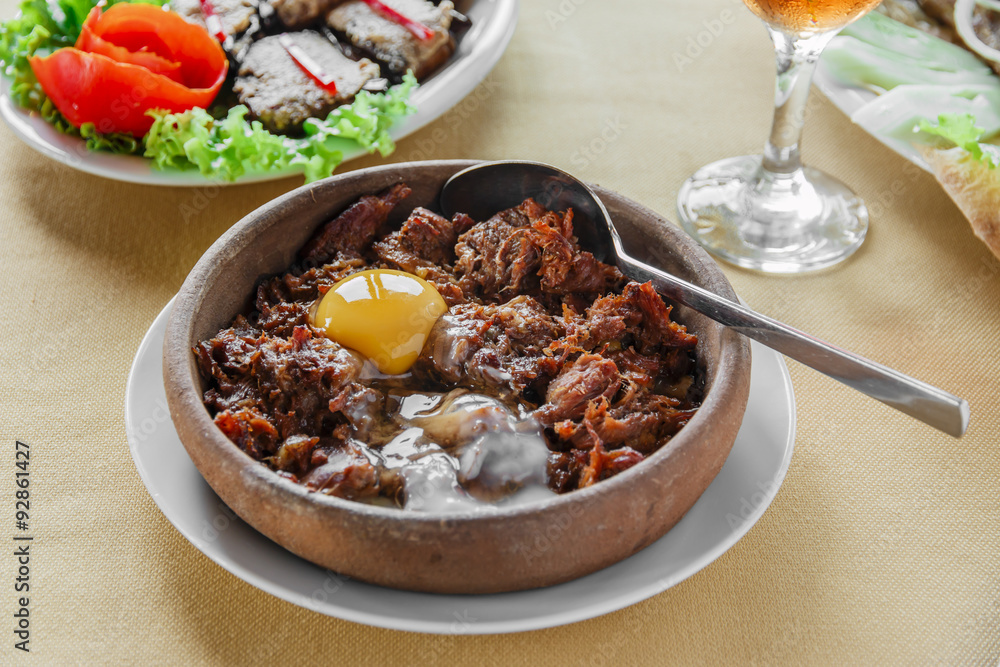 pieces of meat stewed in a clay bowl pieces of meat stewed in a clay bowl