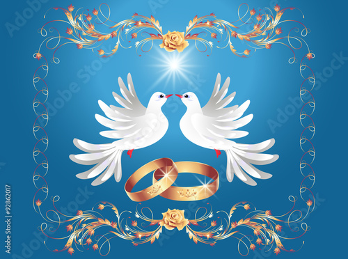 Wedding rings and two doves