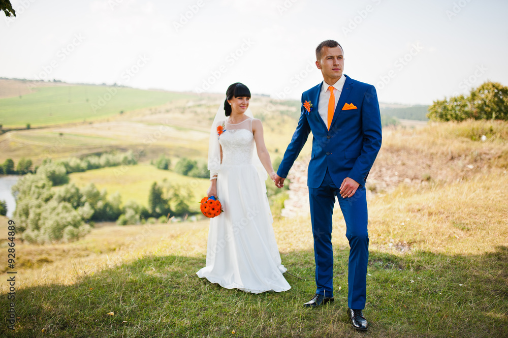 Groom hold hand bride on the hill Groom hold hand bride on the hill
