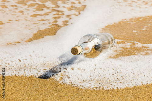 Message in a bottle on the beach