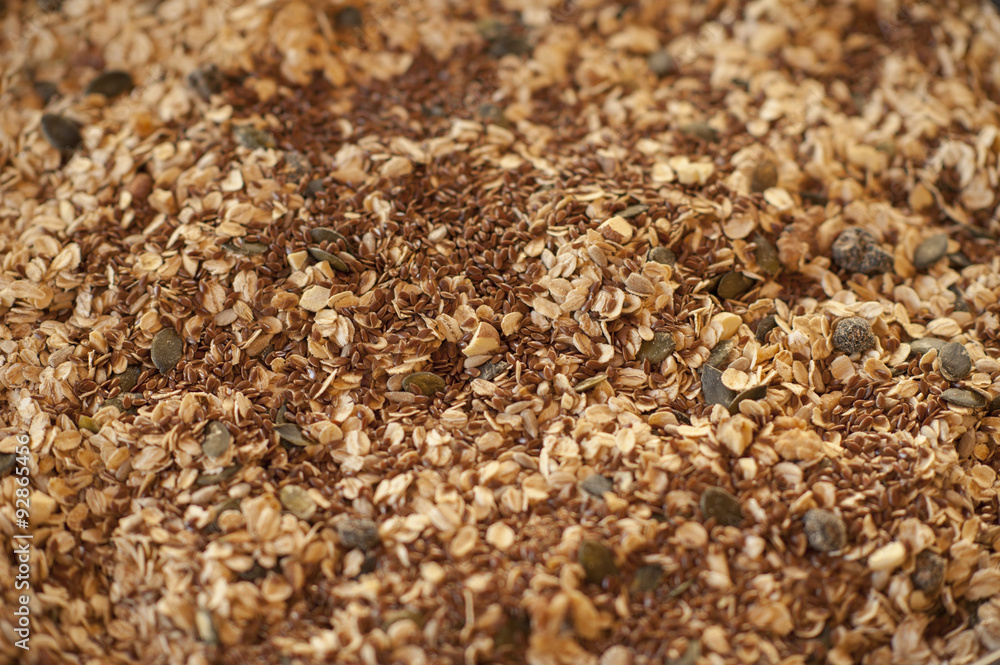 Healthy breakfast. Granola with nuts, seeds, honey, frozen raspberries pumpkin in a wooden biwk on wooden table Healthy breakfast. Granola with nuts, seeds, honey, frozen raspberries pumpkin in a wooden biwk on wooden table