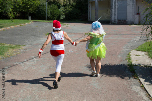 Women with a disguisement in the street photo