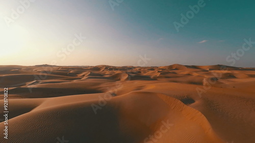 Flying backwards over picturesque sand dunes in the Arabian desert