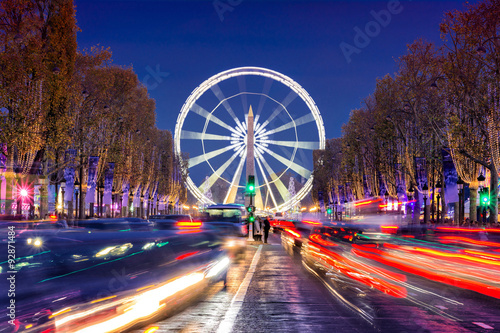Avenue des Champs-Elysees with Christmas lighting leading up to the Grande Roue (Big Wheel) in Paris, France photo