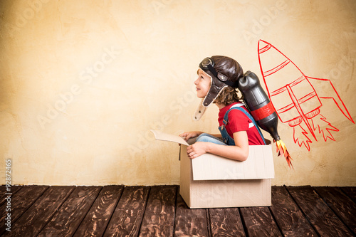 Kid playing with jet pack at home