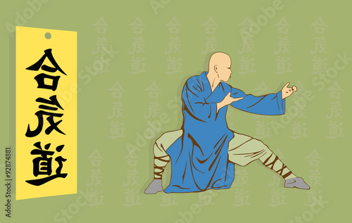 The man shows Kung Fu against a hieroglyph.