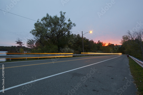 Twilight view of a causeway across Pontoosuc Lake in Pittsfield, Massachusetts. photo