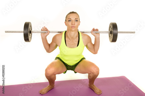 woman green tank top fitness squat front look up