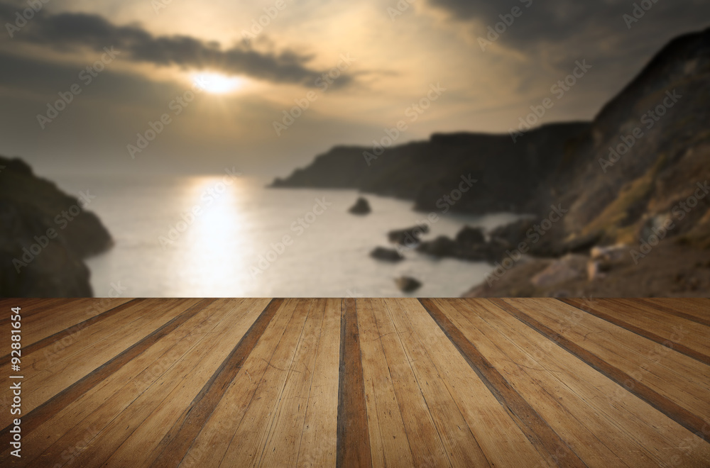 Spring sunset at high tide at Kynance Cove with wooden planks floor