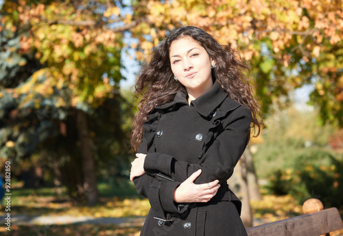 girl portrait at autumn season in city park