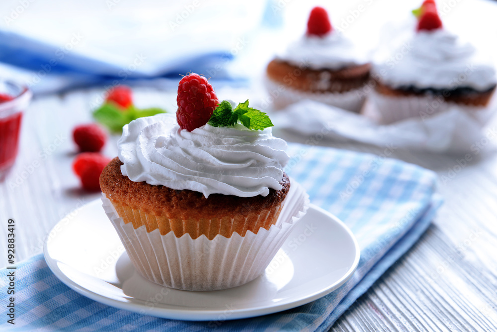 Delicious cupcake with berries on table close up Delicious cupcake with berries on table close up