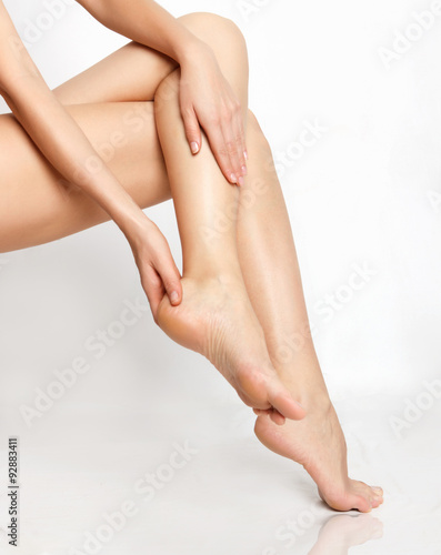 Fototapeta Naklejka Na Ścianę i Meble -  Long woman legs isolated on white. Depilation or another healths concept