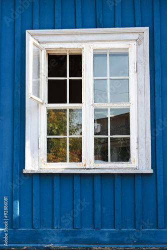 White window in a blue wall