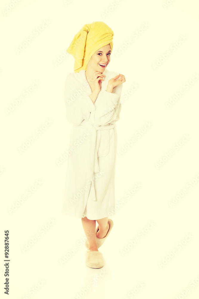 Young smiling woman in bathrobe Young smiling woman in bathrobe