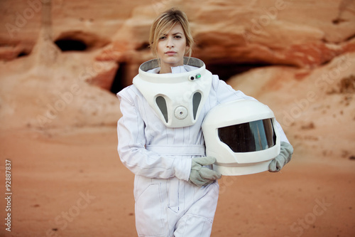 futuristic astronaut without a helmet on another planet, image