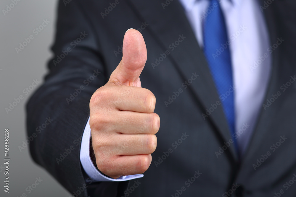 Close up of business man hand with thumb up Close up of business man hand with thumb up